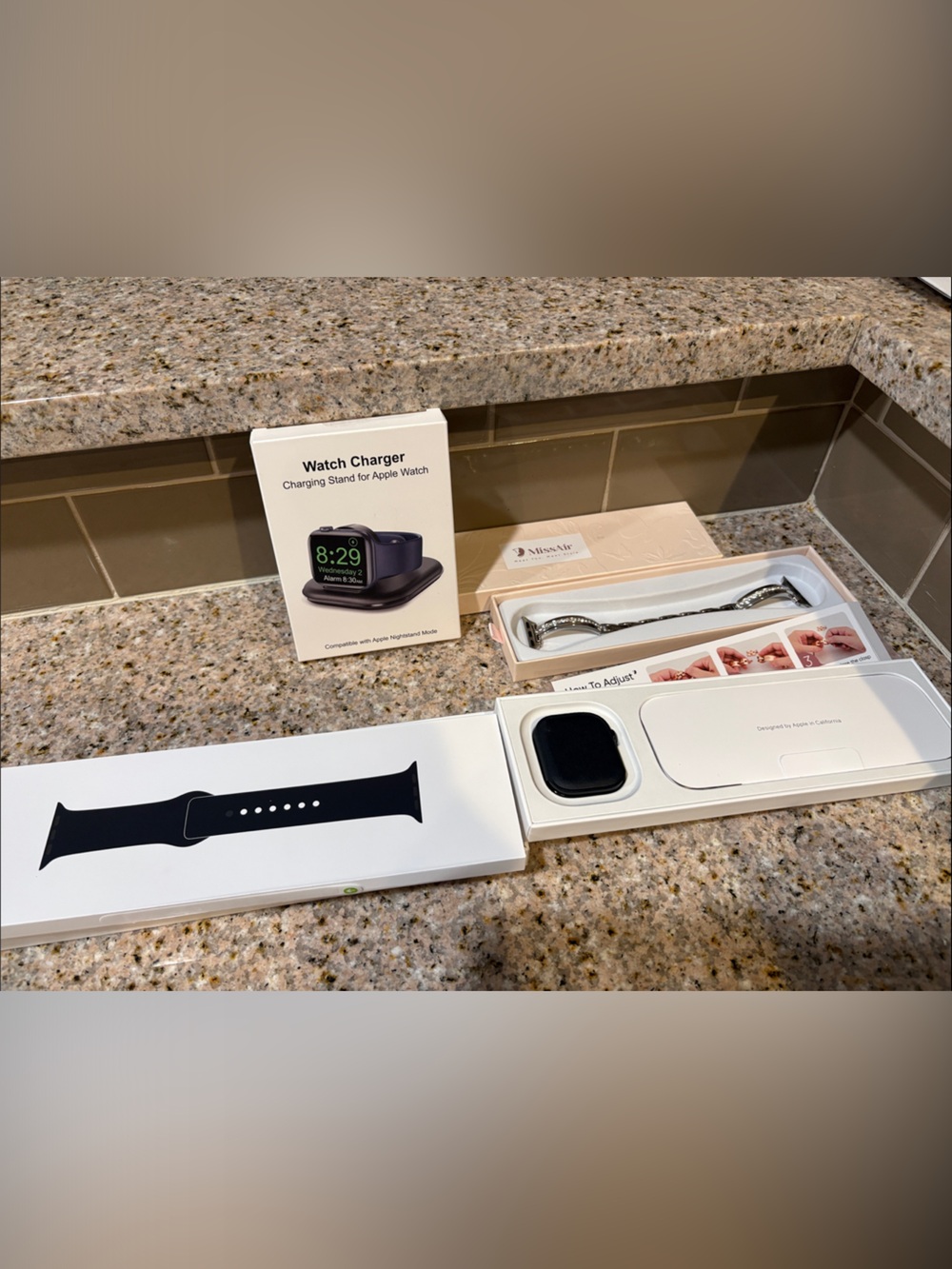 Apple Black Silicone Watch Band with Silver Bracelet Accent and Charging Dock